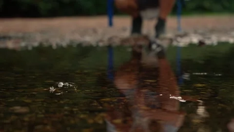 Reflective Stream Close Up with Backpacker Reflection - New England Stock Footage 346803345