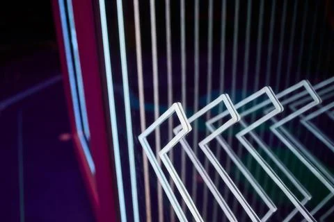 Reflective surface with layered chevron patterns in vibrant colors. Mood Stock Photos