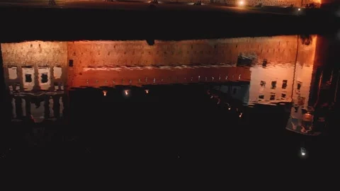 Reflective water surface capturing city lights Stock Footage 301125879