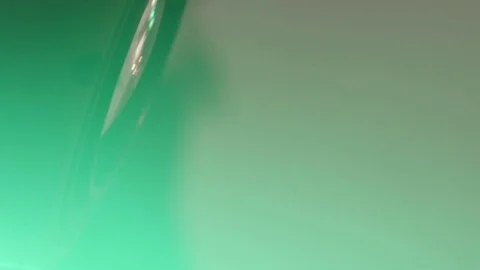 Reflector with colored light that moves over a metal scaffolding in during a Stock Footage 71756260