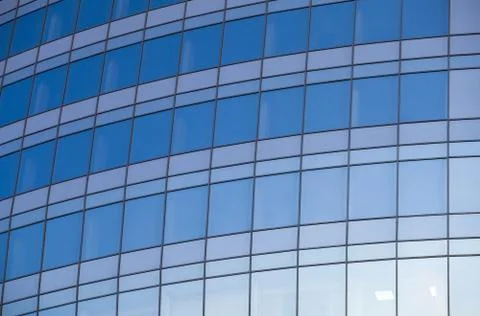 Reflexted windows of rounded office tower Stock Photos