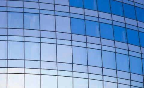 Reflexted windows of rounded office tower Stock Photos