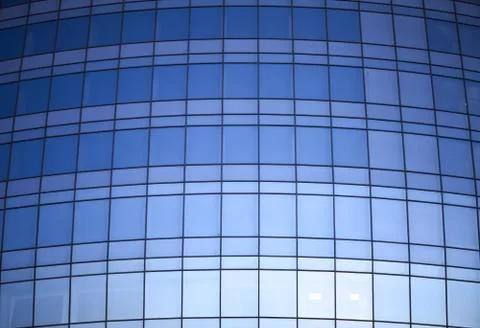 Reflexted windows of rounded office tower Stock Photos