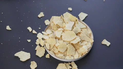 Reflux potato chips are poured into a pl... | Stock Video | Pond5