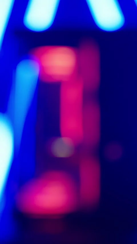 Refocus to cyberspace RGB gaming computer case surrounded with neon lights Stock Footage 324144160