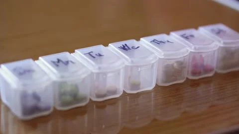 Refocusing from distant to near of plastic organizer box for pills with cells Stock Footage 152422362