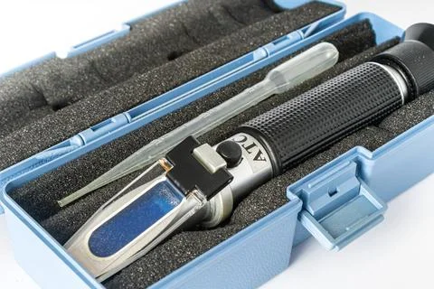 Refractometer used to measure the salinity level in marine aquarium water. Stock Photos