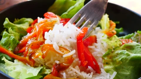 A Refreshing and Vibrant Salad Dish Delightfully Complemented with Rice and Vídeo Stock 311874207