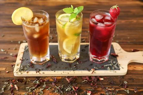 Refreshing assortment of iced beverages displayed on wooden tray with natural Stock Photos