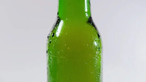 Refreshing beer bottle against white background Stock Footage 296215024