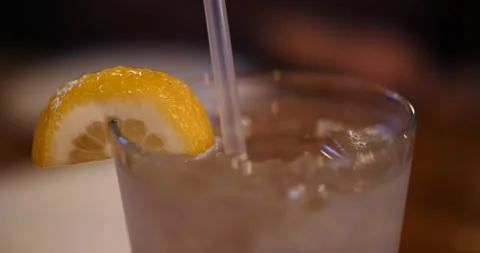 Refreshing beverage with lemon slice served at a cozy restaurant Video stock 281705048
