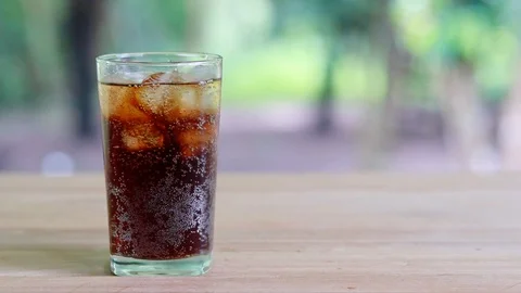 Refreshing black soda soft drinks or cola with ice in a clear tall glass. Stock Footage 95238321