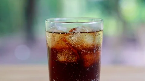 Refreshing black soda soft drinks or cola with ice in a clear tall glass. Stock Footage 95238369
