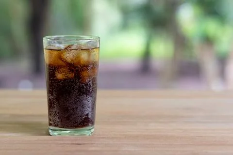 Refreshing black soda soft drinks or cola with ice in a clear tall glass wi.. Stock Photos