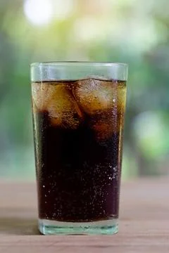Refreshing black soda soft drinks or cola with ice in a clear tall glass wi.. Stock Photos