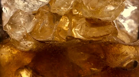 Refreshing Brown Soda with Ice cubes and bubbles Stock Footage 60041793