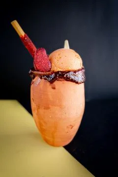 Refreshing cantarito with tequila and mango snow. Stock Photos