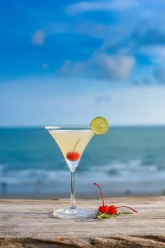 Refreshing cocktail on beach table. Stock Photos