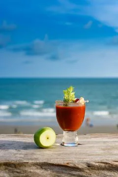Refreshing cocktail on beach table. Stock Photos