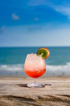 Refreshing cocktail on beach table. Stock Photos