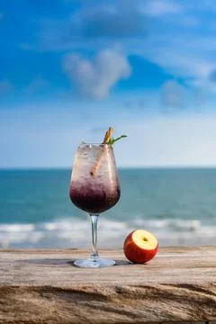 Refreshing cocktail on beach table. Stock Photos