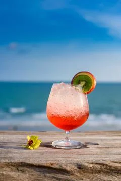 Refreshing cocktail on beach table. Stock Photos