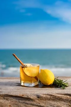 Refreshing cocktail on beach table. Stock Photos