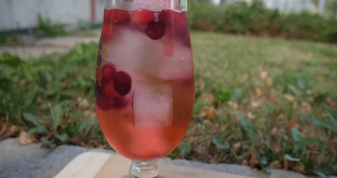 Refreshing cocktail Boston Iced Tea with cranberries. Shot from different angles Stock Footage 100005905