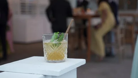 A Refreshing Cocktail Delightfully Served at a Chic and Upscale Event Experience Video stock 314577758