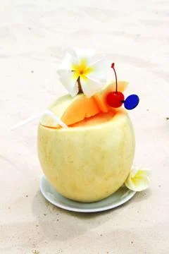 The refreshing cocktail in melon Stock Photos