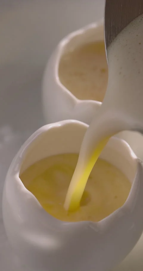 Refreshing cocktail pouring from shaker in egg shots. Summer drink with alcohol Stock-Footage 312350737