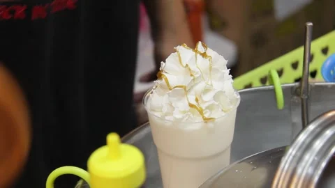 Refreshing coconut smoothie blended with ice and natural sweetness Stock Footage 330233031