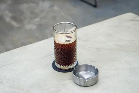 A refreshing coffee drink made by combining rich espresso with cold water Stock Photos