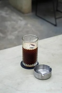 A refreshing coffee drink made by combining rich espresso with cold water Stock Photos