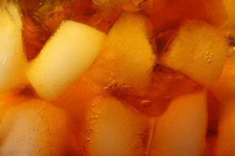 Refreshing coffee with ice cubes as background, closeup Stockfoto's