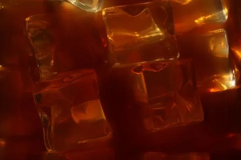 Refreshing coffee with ice cubes as background, closeup Foto stock