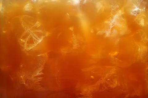 Refreshing coffee with ice cubes as background, closeup 写真素材