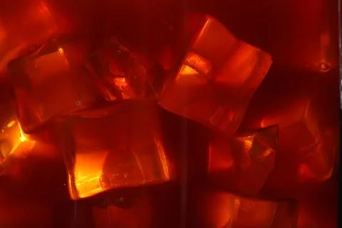Refreshing coffee with ice cubes as background, closeup Foto stock