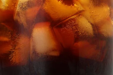 Refreshing coffee with ice cubes as background, closeup Foto stock