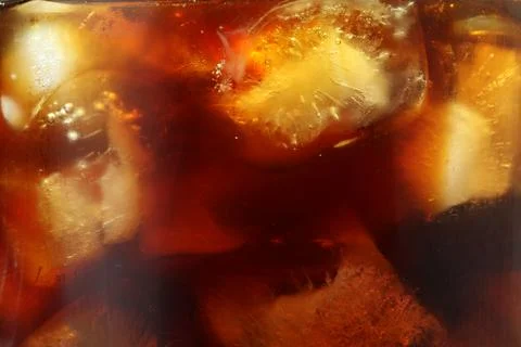 Refreshing coffee with ice cubes as background, closeup Stock Photos