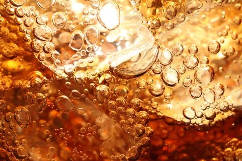 Refreshing cola with ice as background, macro view Foto stock