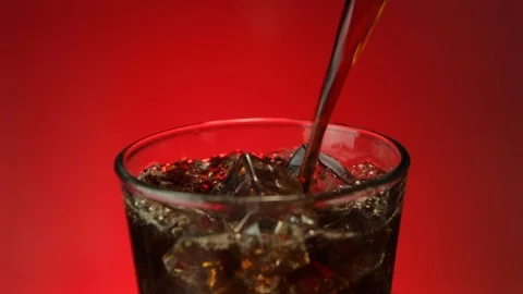 Refreshing Cola Soda Splashing in Ice Stock-Footage 107992081