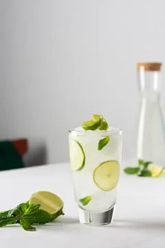 Refreshing cold drink with lime and mint Stock Photos