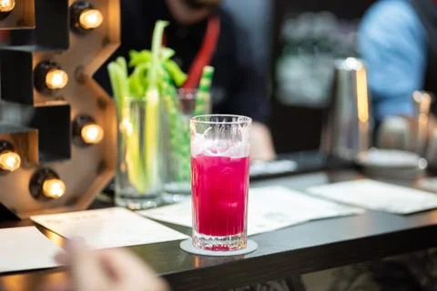 Refreshing cold pink cocktail in a tall glass Stock Photos