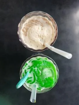 A refreshing combination of Es Cendol and Cappuccino drinks Stock Photos
