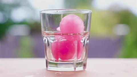 Refreshing cool drink with sparkling water, blackberries and grenadine ice cubes Stock Footage 344866411