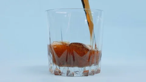 Refreshing cool soda with the taste of Cola. Drink with bubbles and foam Stock Footage 130118166