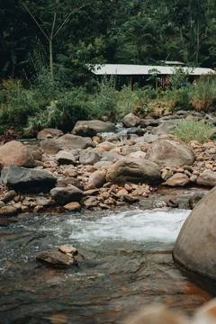 Refreshing Curug Sentul: Clear River Flowing from Waterfall, Surrounded by .. Stock Photos