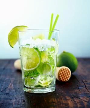 Refreshing drink with fresh lime slices Stock Photos