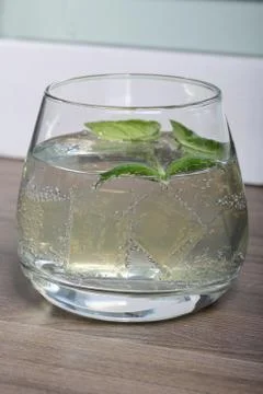 Refreshing drink with gas bubbles. Nalit in a transparent glass. It laid crus 写真素材